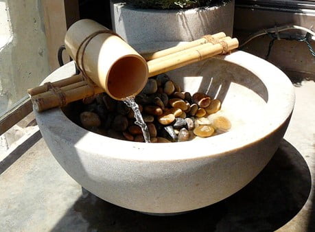 Basin with Pebbles and A Bamboo Faucet
