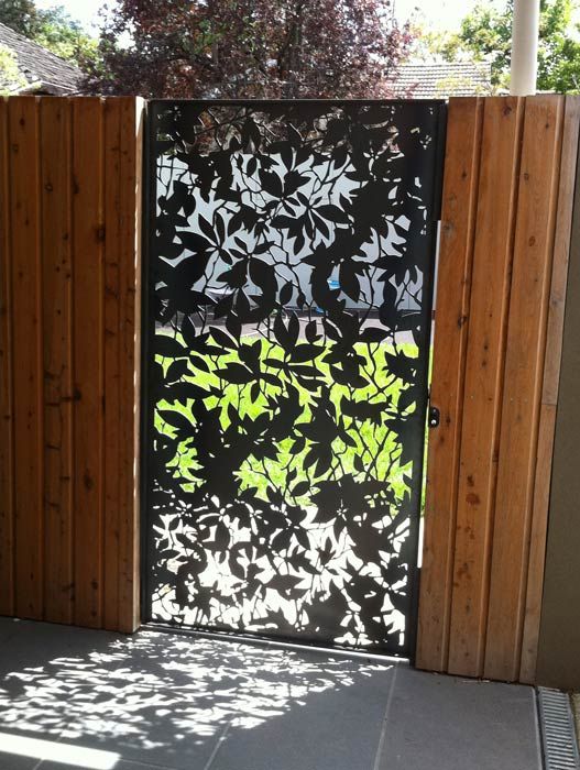 Etched metal fence door