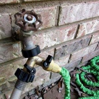 Garden Hose Connected to Faucet