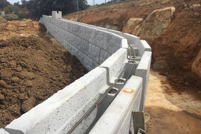 What Is the Purpose of a Retaining Wall? - Organize With Sandy