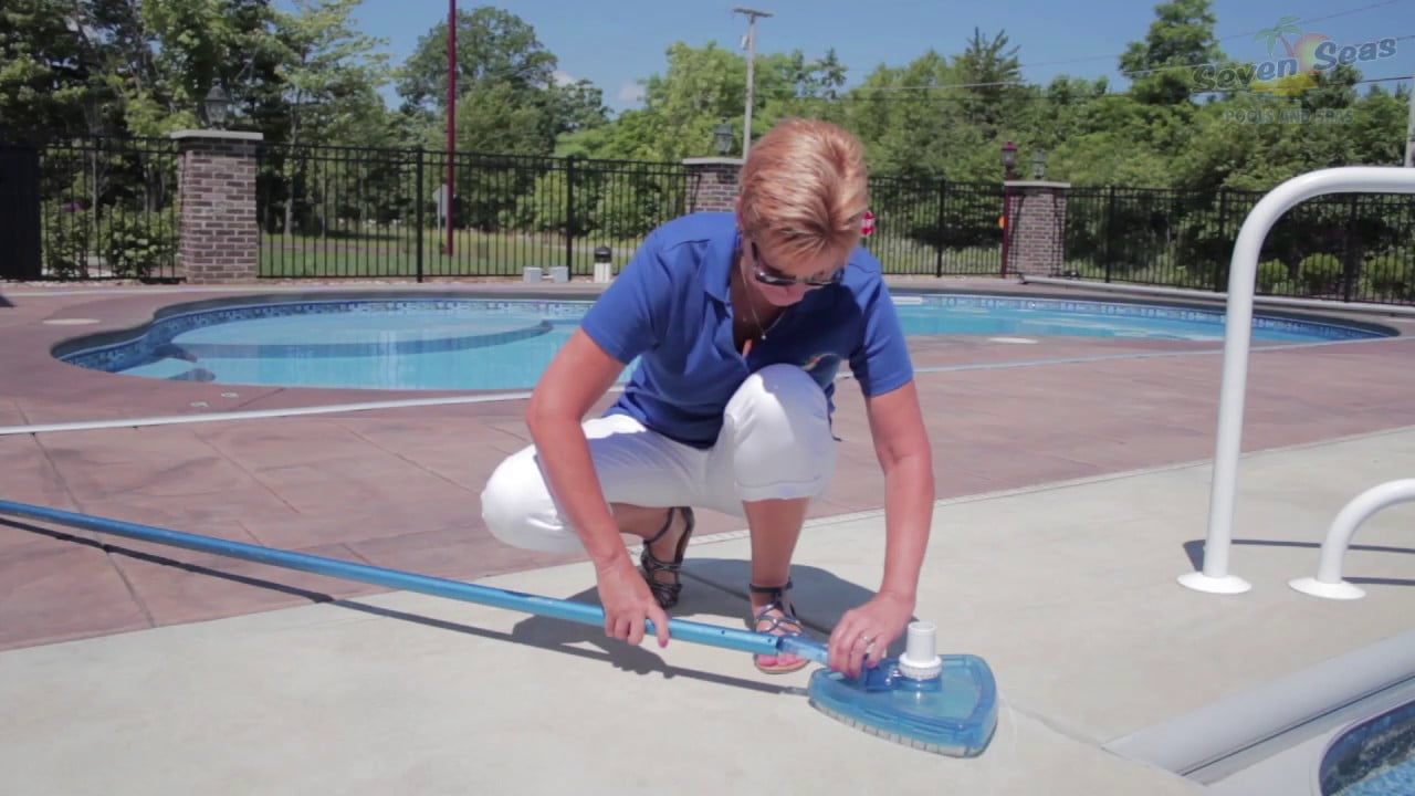 vacuuming inground pool