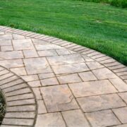 How to Install Pavers Over a Concrete Patio and Driveway