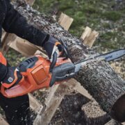 Why do chainsaws cut on an angle?