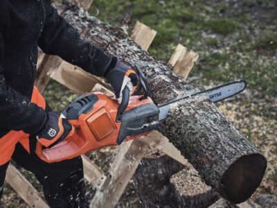 Why do chainsaws cut on an angle?