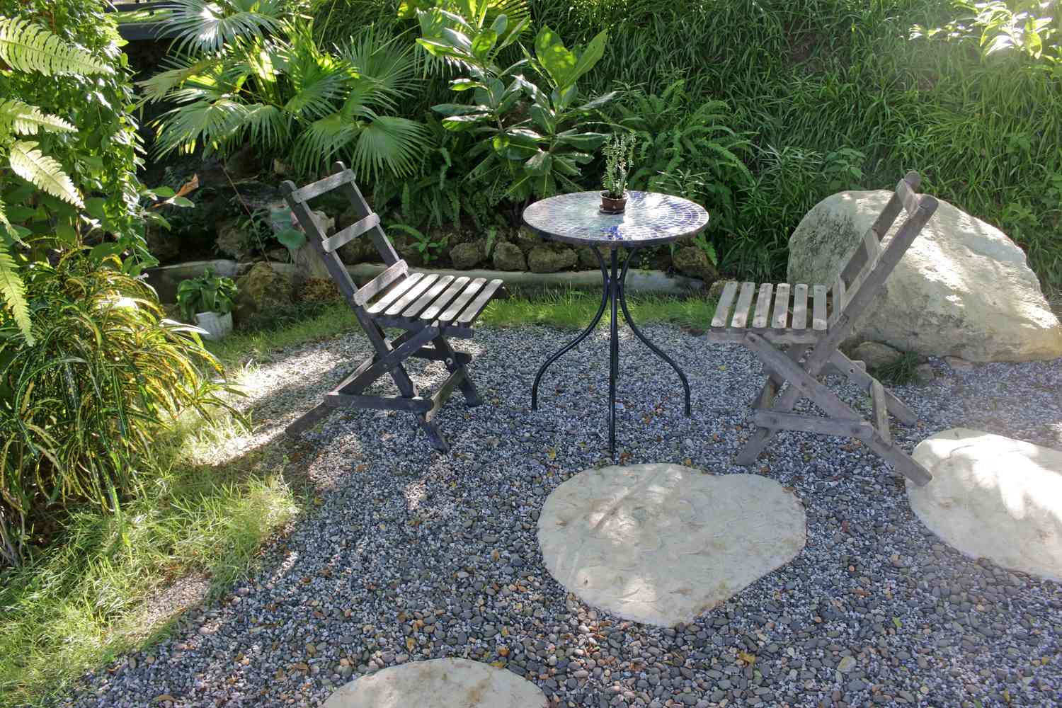 A beautiful pea gravel patio with comfortable outdoor furniture