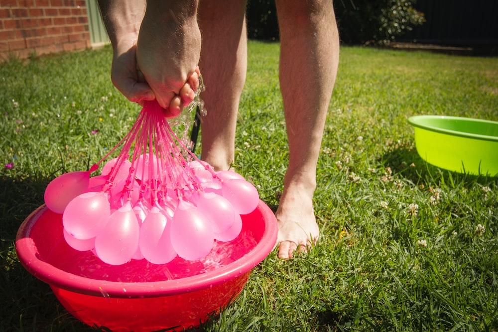 a bucket of pink balloons, ready for a fun-filled celebration with self-sealing water balloons