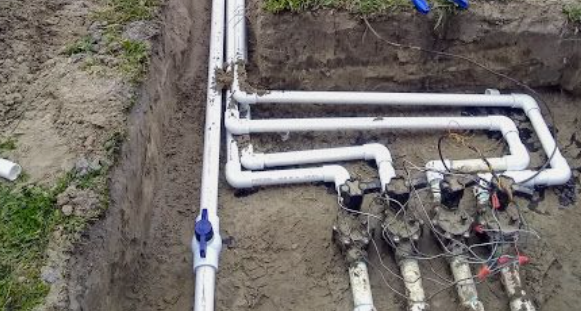 A pipe and a hose are connected together, forming a connection