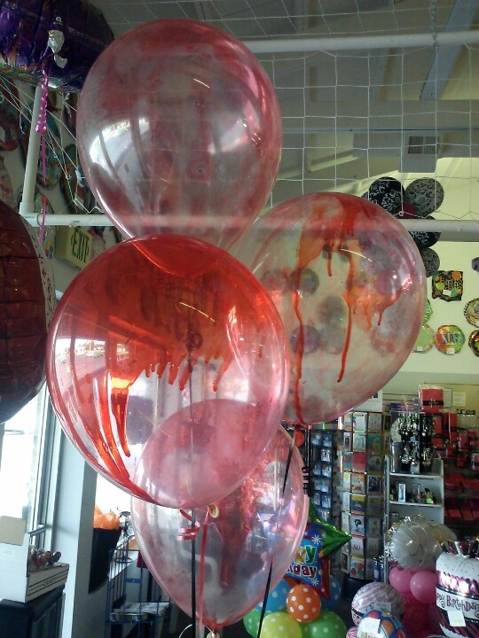 Colorful balloons fill a store