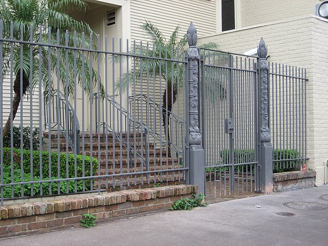 A fence with a gate, providing access and security. The height of the fence depends on local regulations