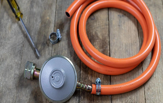propane regulator with orange pipe